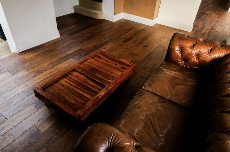 Dark solid wood flooring in living room