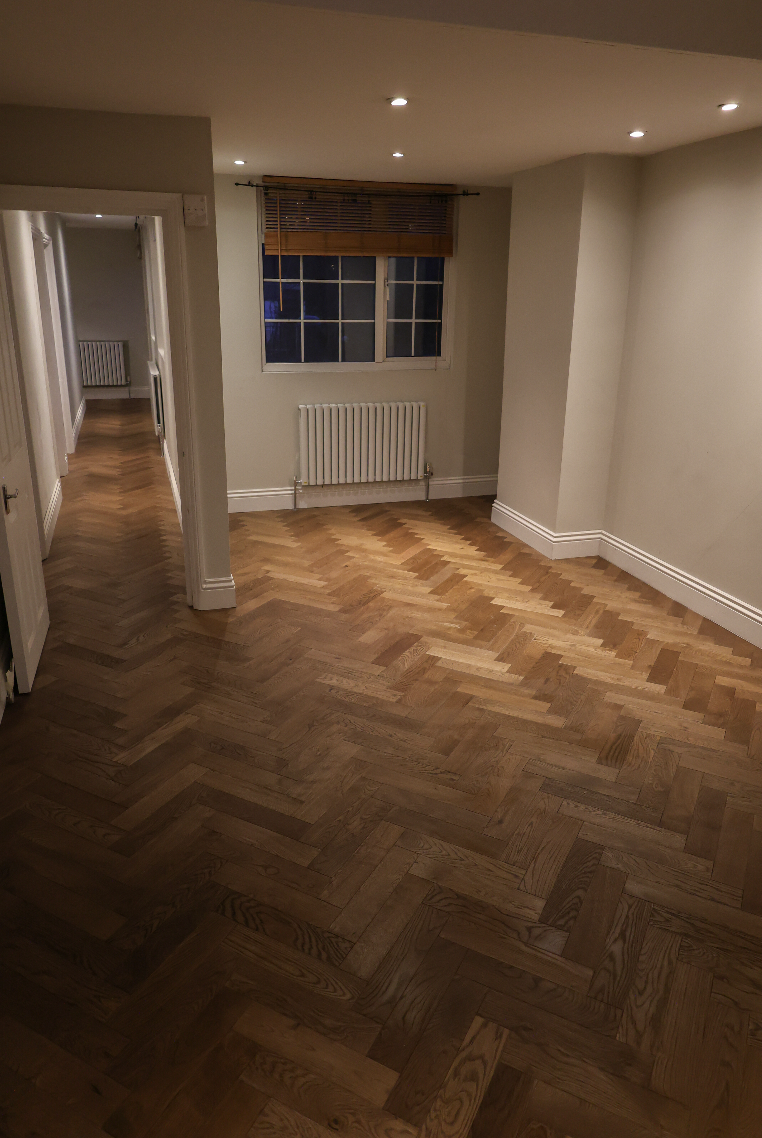 Herringbone oak parquet flooring installation