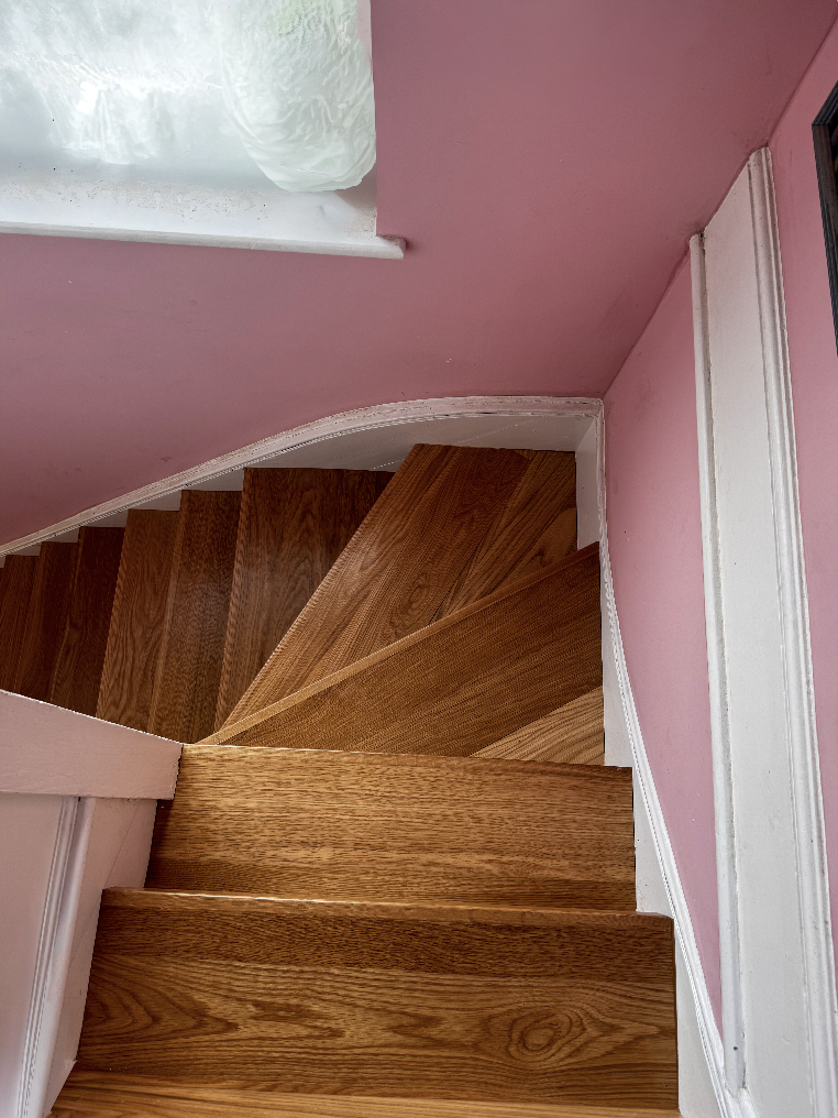 Curved oak staircase fitted in Essex property